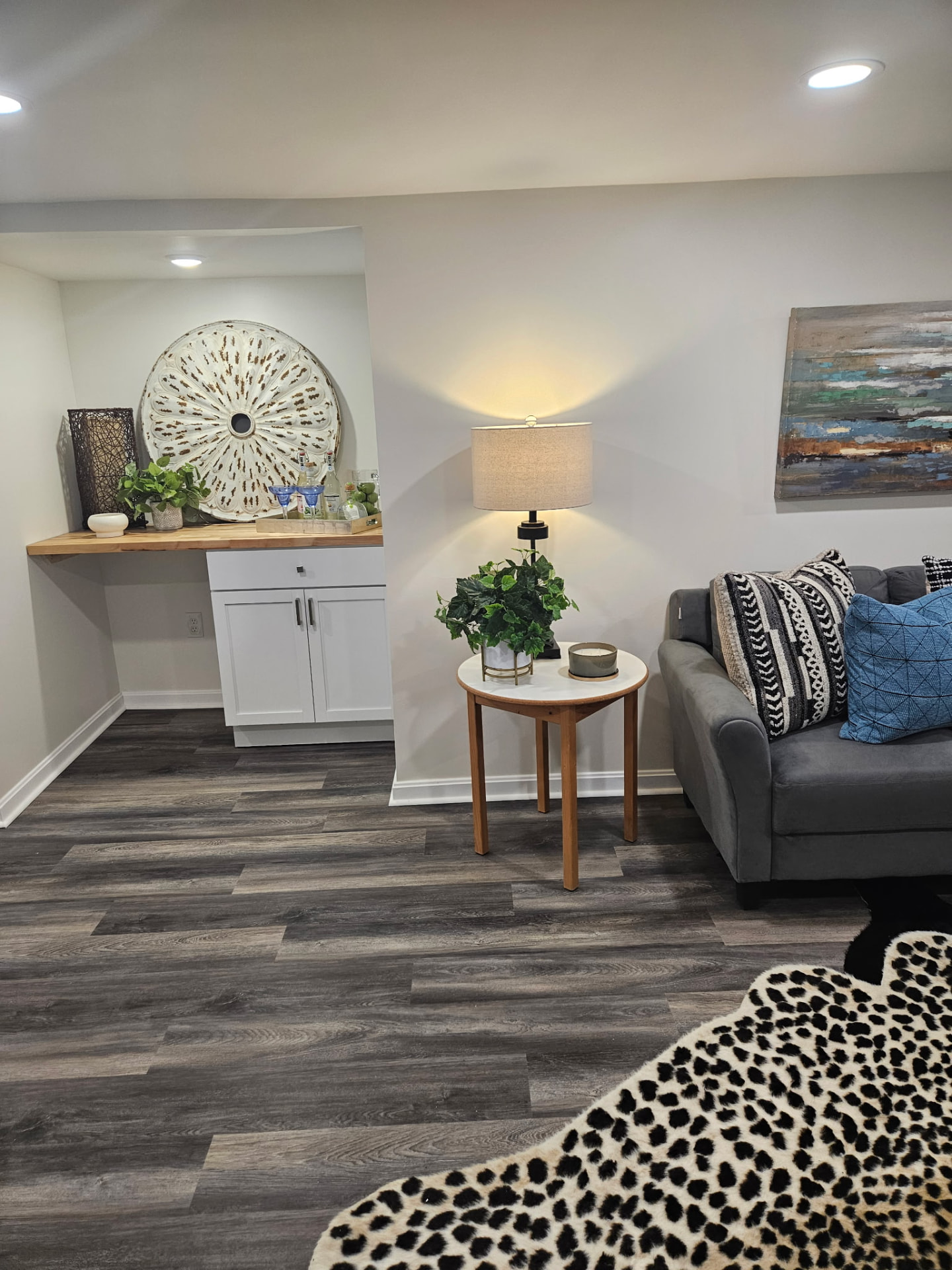Finished laminate flooring in a remodeled basement living area